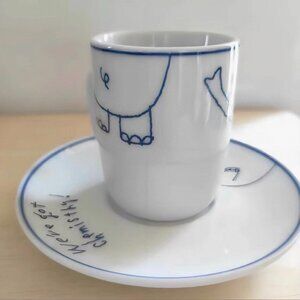 White Ceramic Cup & Saucer with Minimal Cartoon Illustration